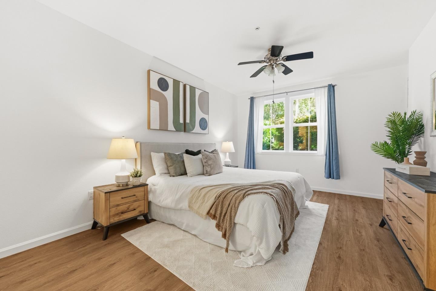 1390 Saddle Rack Street, Unit 223 San Jose, CA 95126 - Photo 13 of 36 a spacious bedroom with a bed and a chandelier