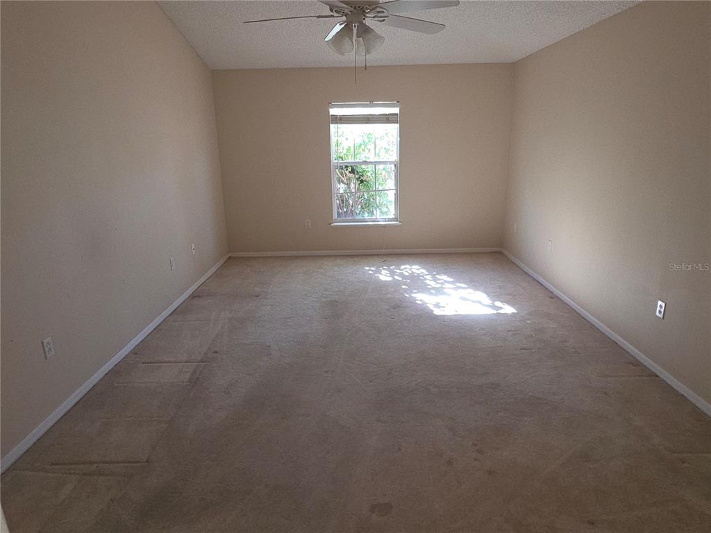 10563 Marysville Street Spring Hill, FL 34608 - Photo 13 of 22 an empty room that has a window in it