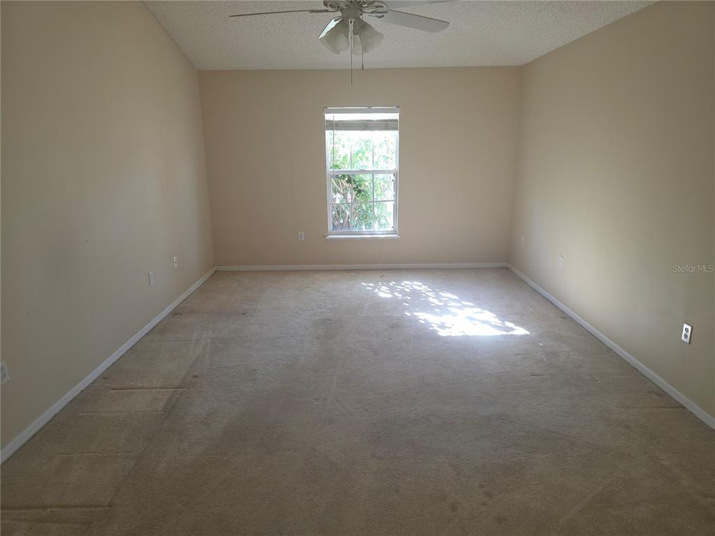 10563 Marysville Street Spring Hill, FL 34608 - Photo 9 of 22 an empty room that has a window in it