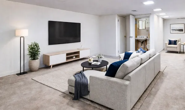 a living room with furniture and a flat screen tv