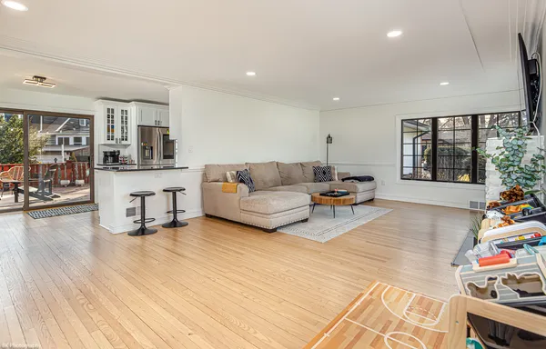 a living room with furniture and large window