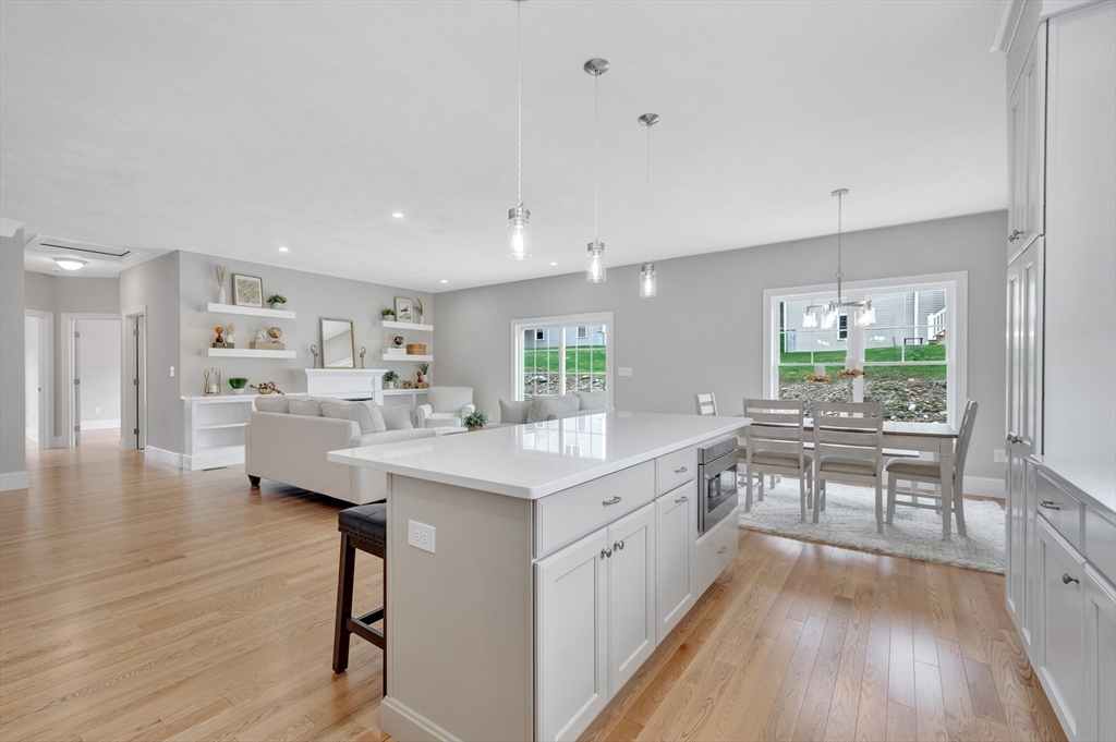 8 Weber Farm Road, Unit 8 Wrentham, MA 02093 - Photo 25 of 35 a kitchen with counter top space and wooden floor