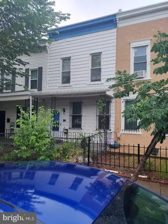 a view of a house with brick walls
