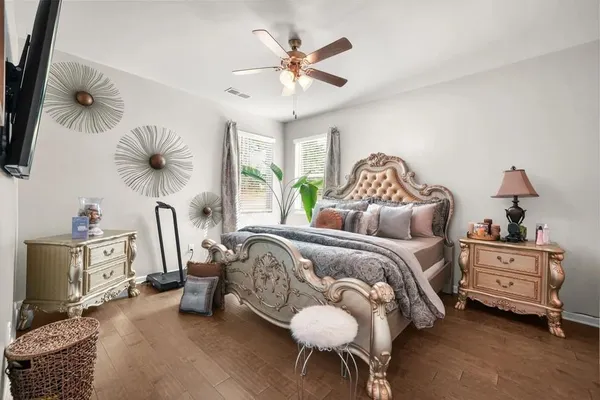 a bedroom with furniture and a chandelier
