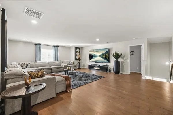 a living room with furniture and a table