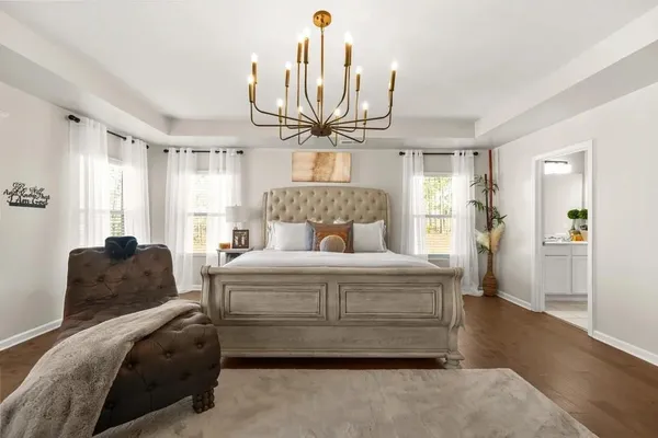 a bedroom with a bed and window