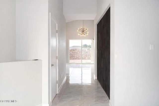 a view of a hallway with windows