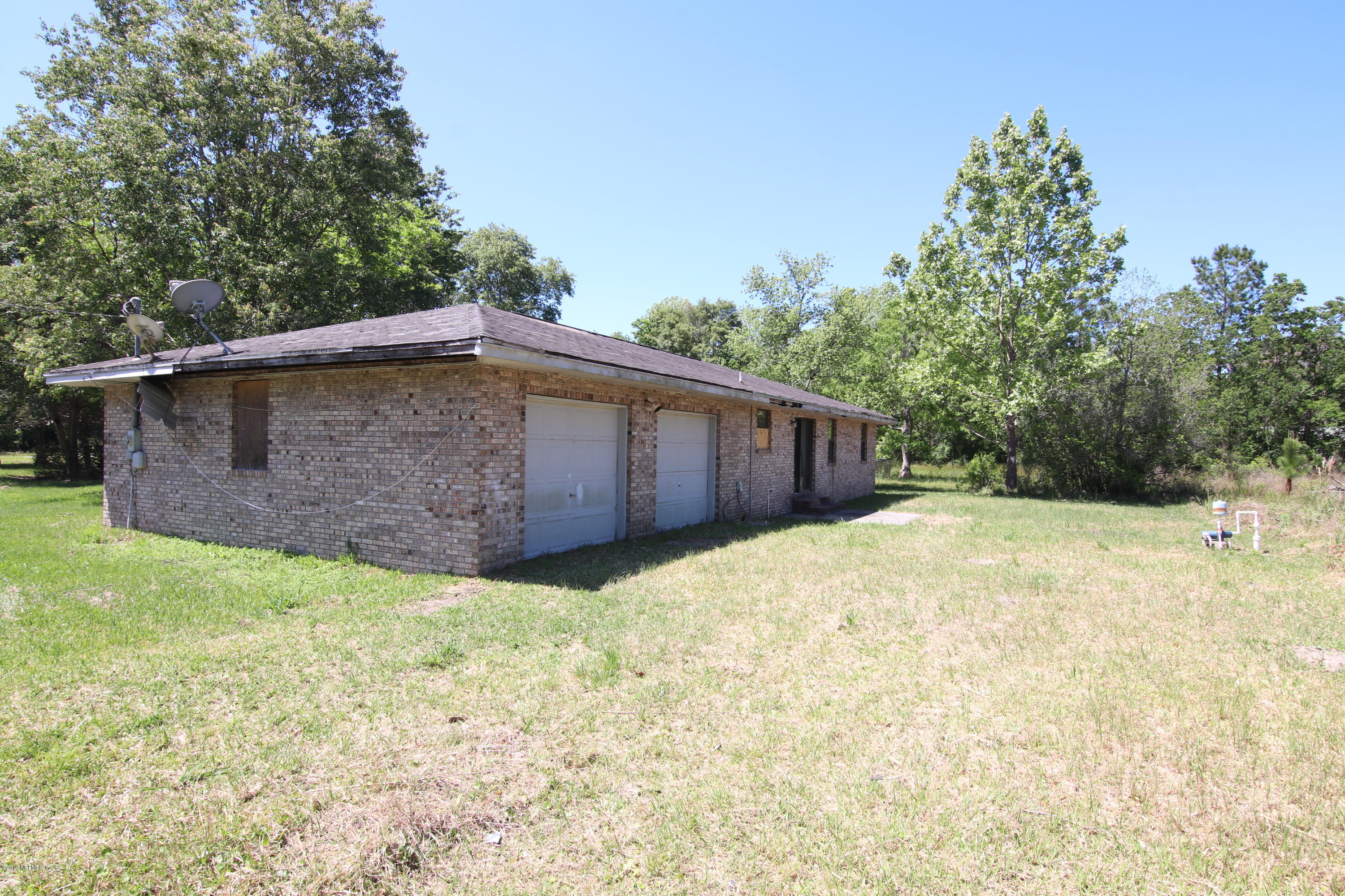 54344 Hurst Road Callahan, FL 32011 - Photo 18 of 55 a backyard of a house with lots of green space