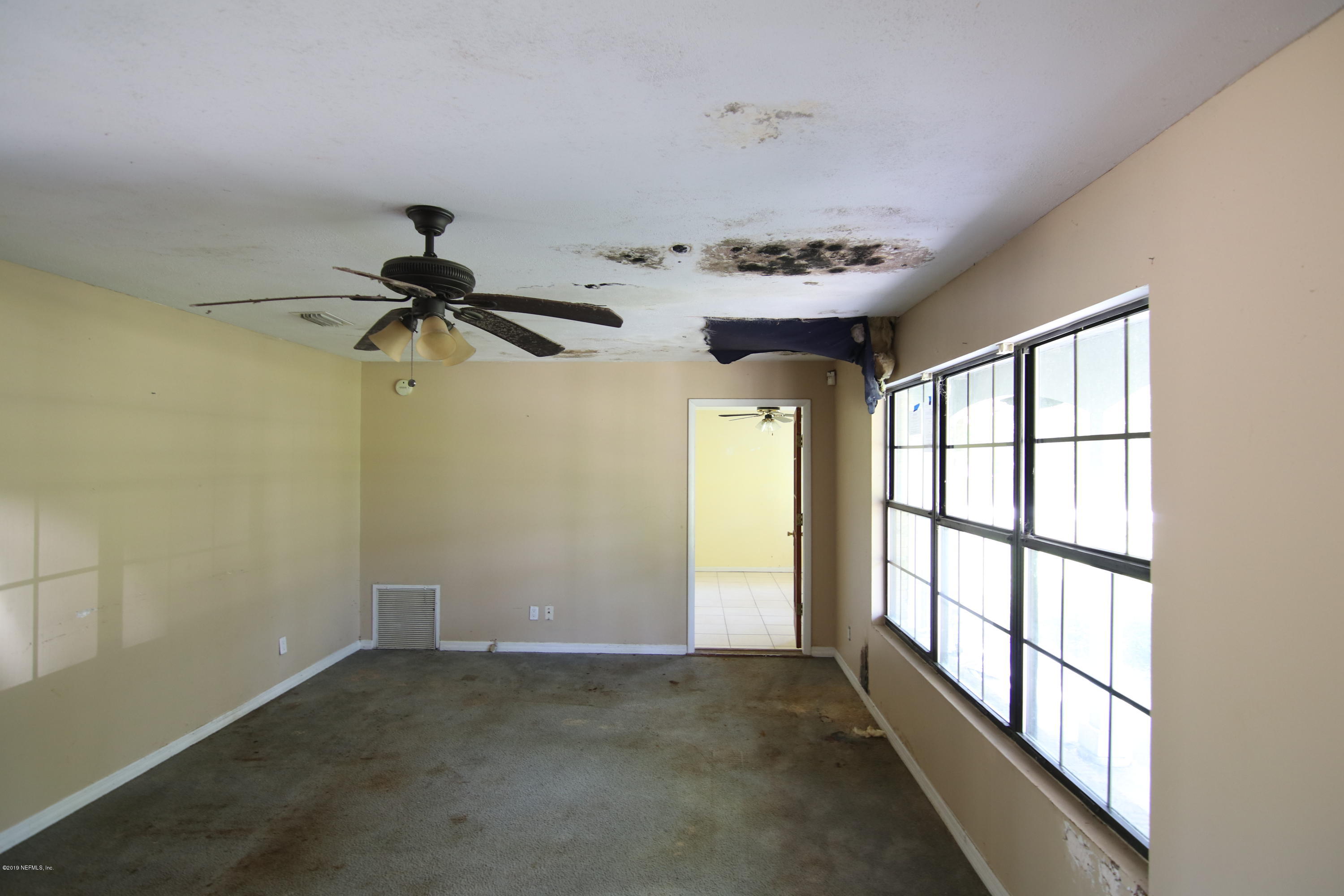 54344 Hurst Road Callahan, FL 32011 - Photo 23 of 55 a view of empty room with windows