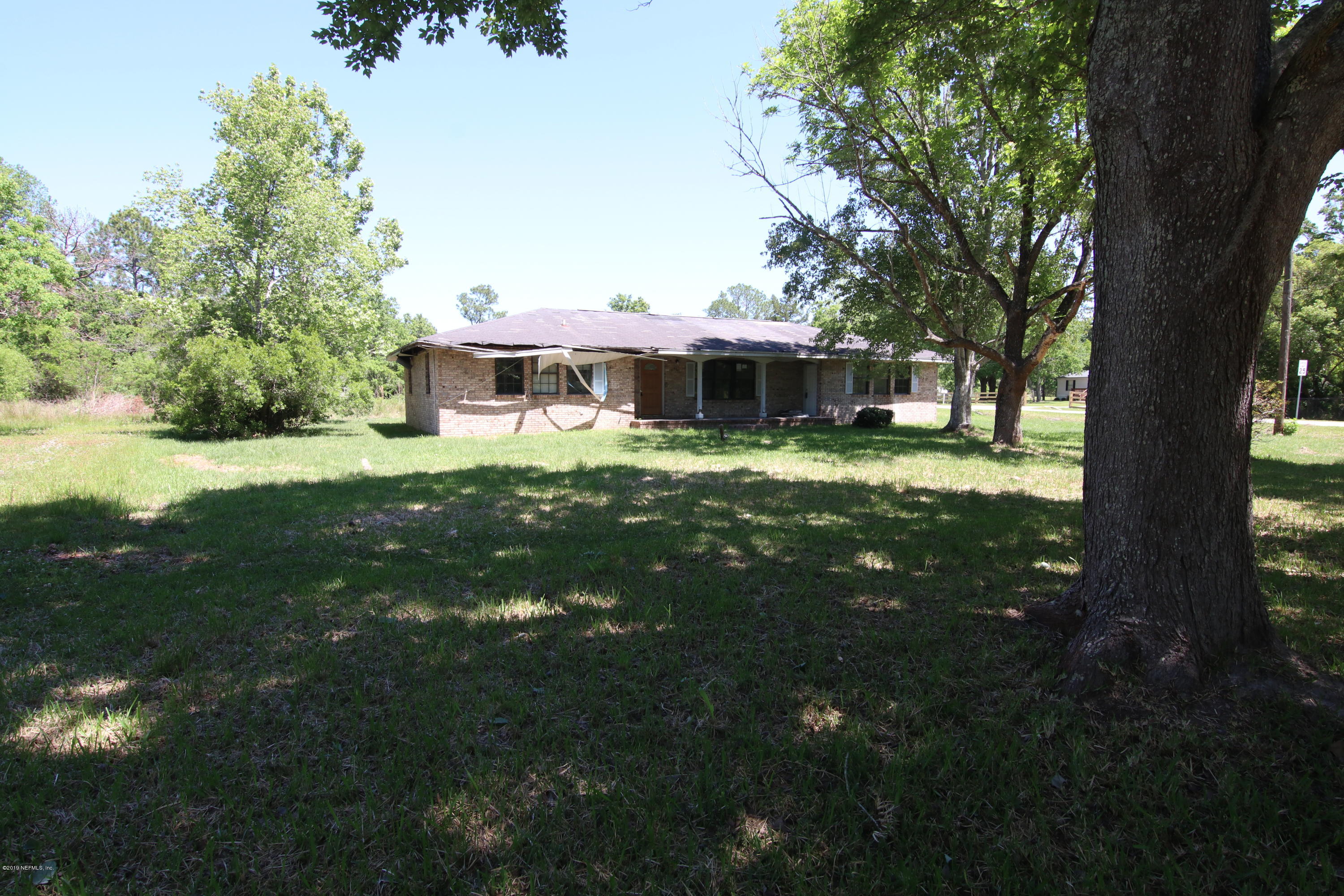 54344 Hurst Road Callahan, FL 32011 - Photo 28 of 55 a view of a house with a yard porch and sitting area