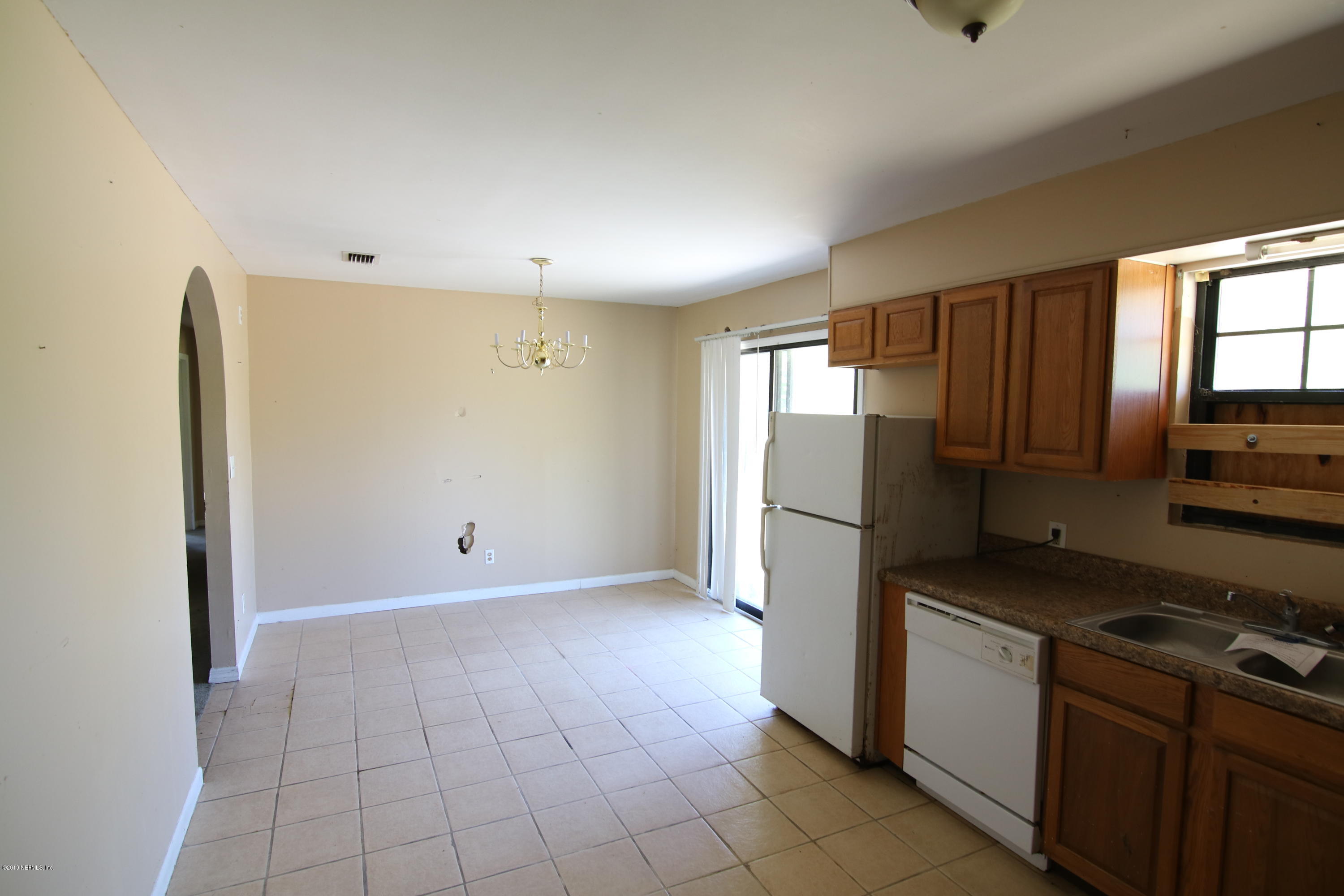 54344 Hurst Road Callahan, FL 32011 - Photo 32 of 55 a kitchen with a refrigerator sink and stove