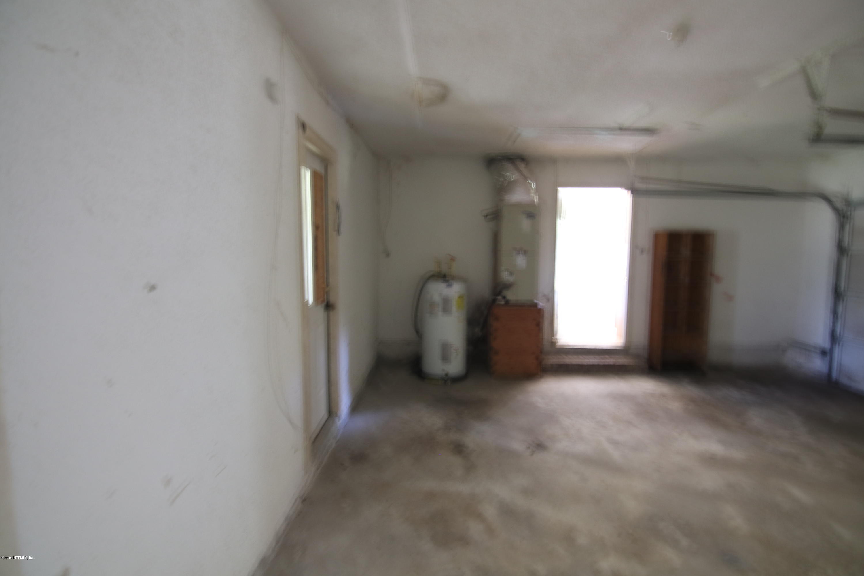 54344 Hurst Road Callahan, FL 32011 - Photo 38 of 55 a view of a big room with windows and chandelier