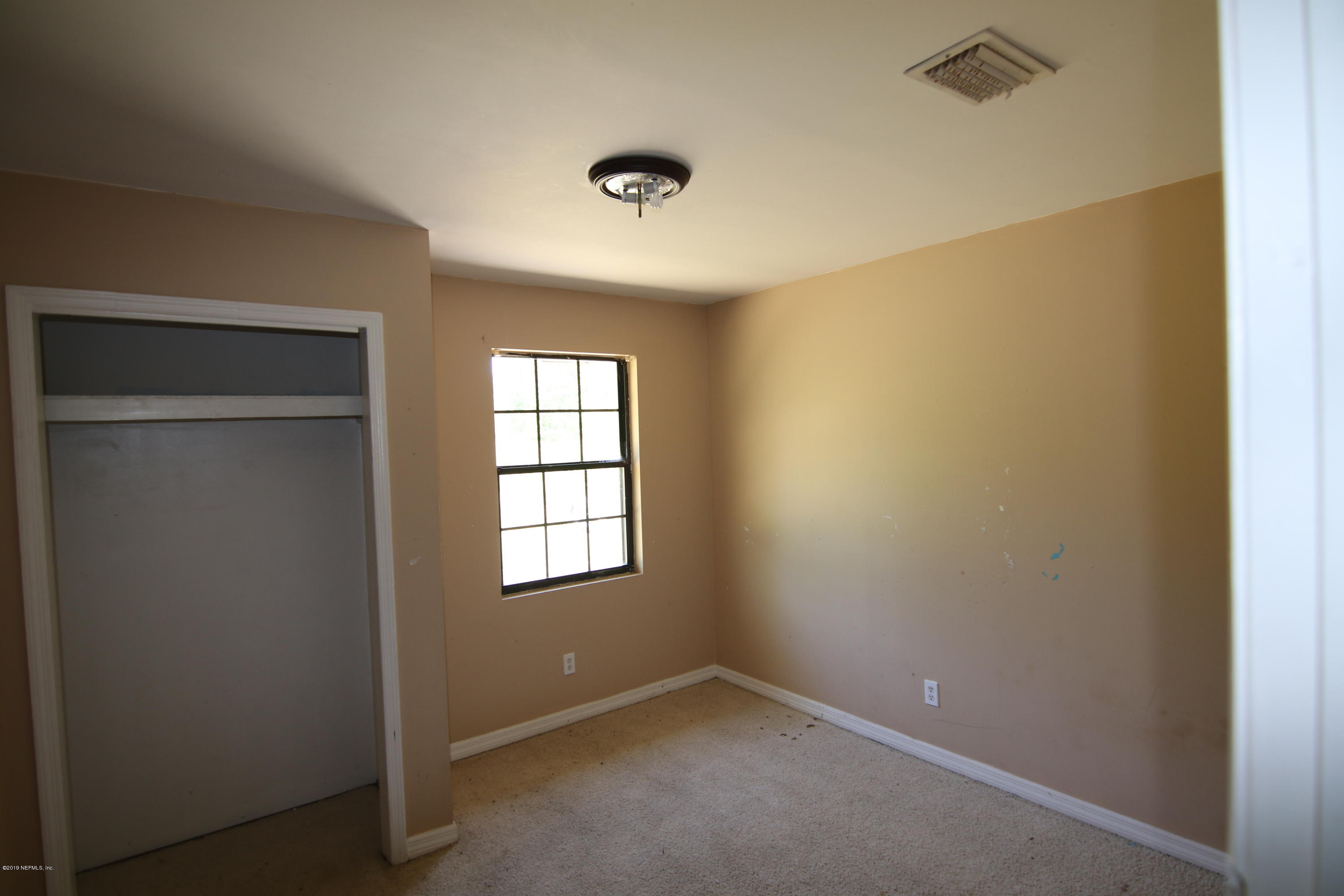54344 Hurst Road Callahan, FL 32011 - Photo 52 of 55 a view of an empty room with a window