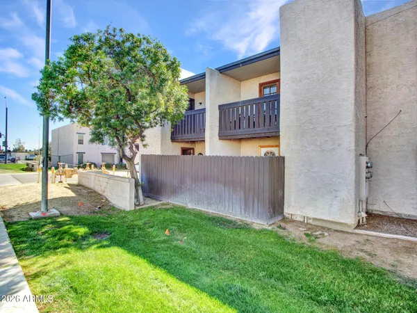 a living room with furniture and a dining table