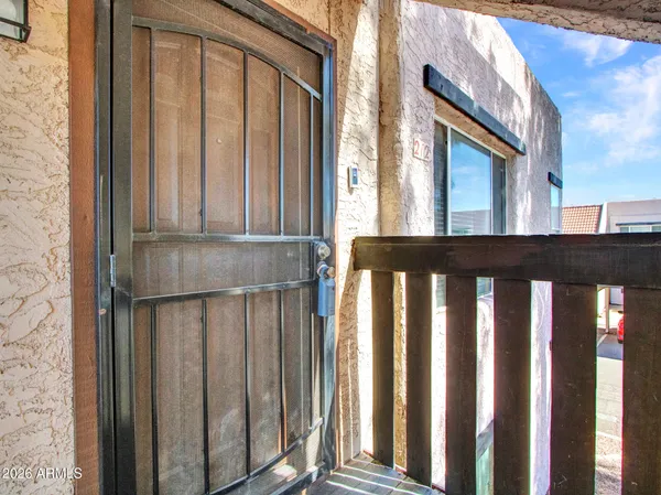 a living room with furniture and a ceiling fan