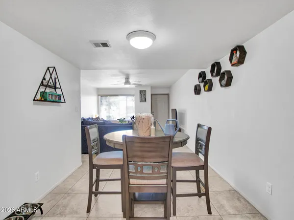 a kitchen with stainless steel appliances wooden cabinets and a stove top oven