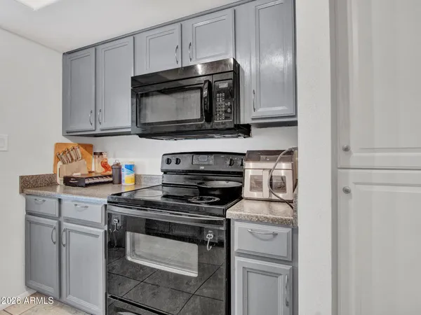 a view of a porch with a table and chairs