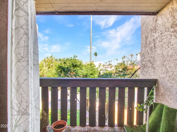 a bedroom with a bed and a desk