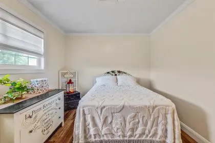 a spacious bedroom with a bed and a table