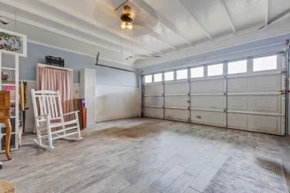 a view of a livingroom with furniture and windows