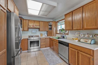 17959 Pesante Road Salinas, CA 93907 - Photo 8 of 24 a kitchen with stainless steel appliances granite countertop a stove sink and cabinets