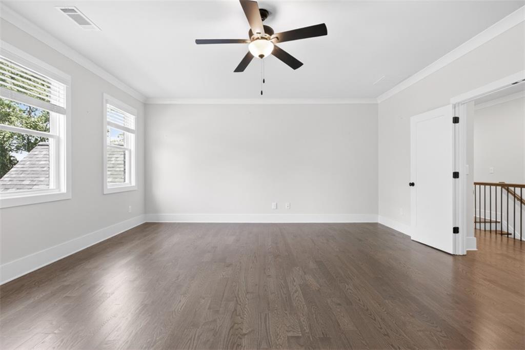 3528 North Bogan Road Buford, GA 30519 - Photo 44 of 79 a view of an empty room with wooden floor and a window