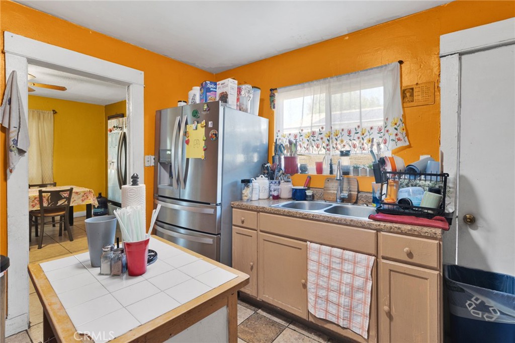1132 Calhoun Street Redlands, CA 92374 - Photo 12 of 27 a kitchen with stainless steel appliances a sink and cabinets