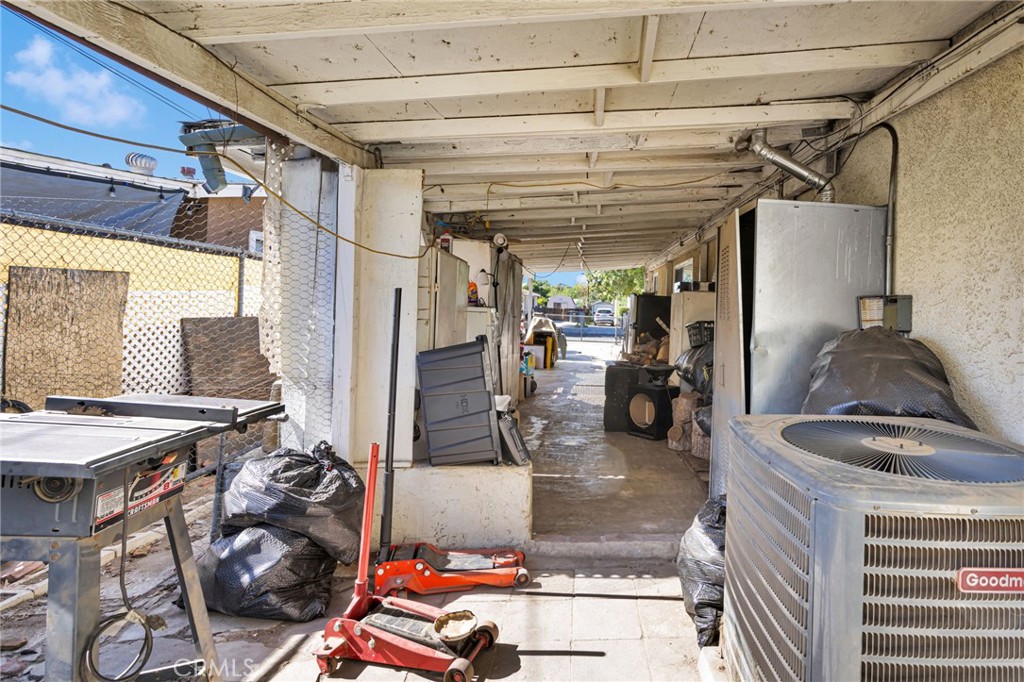 1132 Calhoun Street Redlands, CA 92374 - Photo 27 of 27 a gym room with lots of furniture and clutter