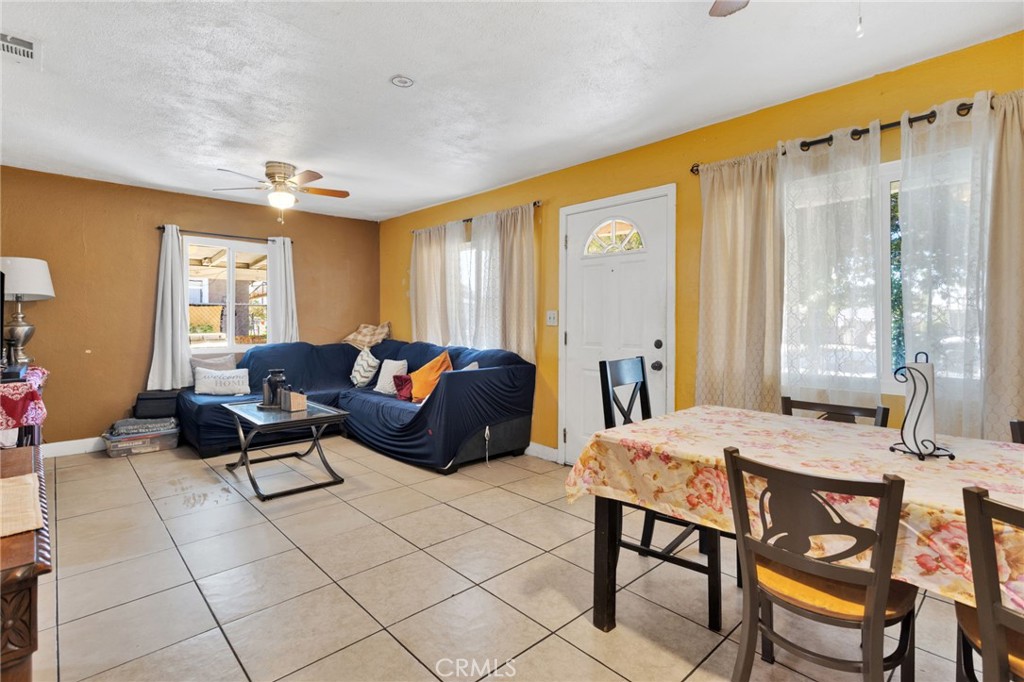1132 Calhoun Street Redlands, CA 92374 - Photo 7 of 27 a living room with furniture and a large window