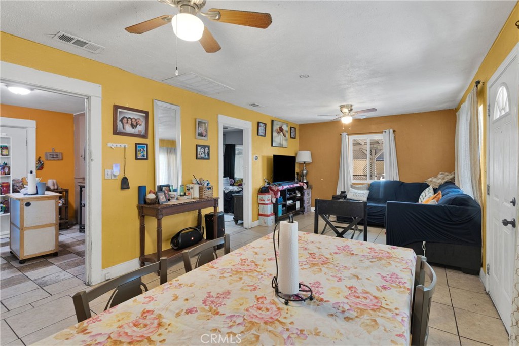 1132 Calhoun Street Redlands, CA 92374 - Photo 8 of 27 a living room with furniture windows and a flat screen tv
