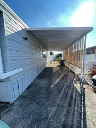 a view of a backyard with pathway