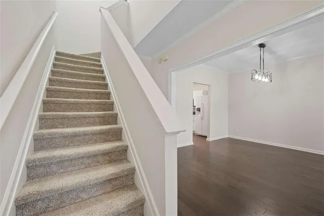 a view of staircase with white walls
