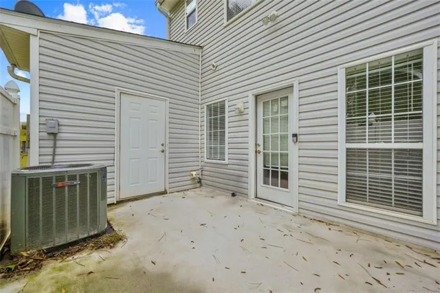 a view of a house with a door and a window