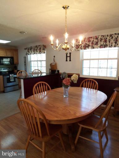8060 Athena Street Springfield, VA 22153 - Photo 5 of 21 a view of a dining room with furniture