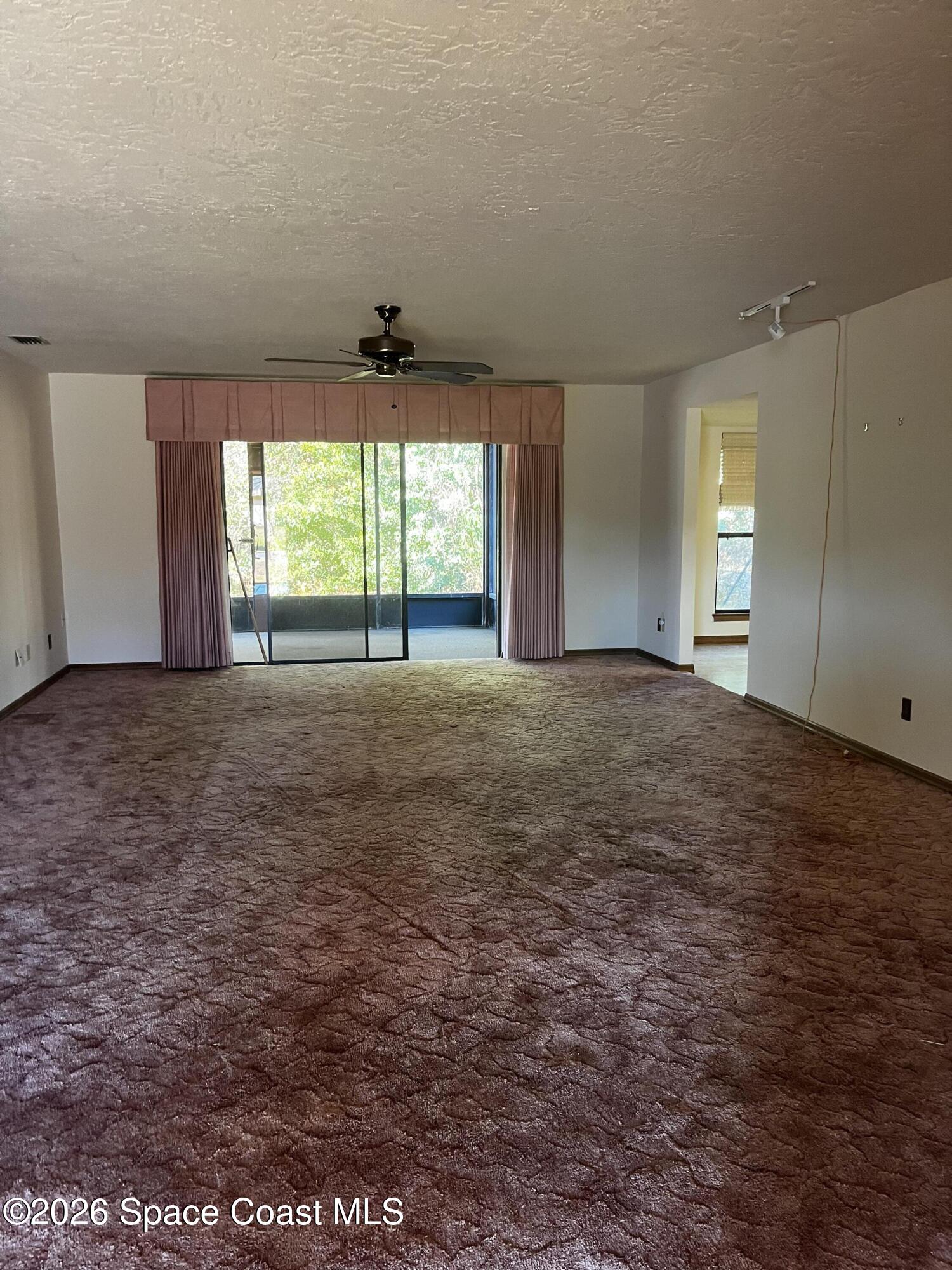 2328 Hamlet Drive Melbourne, FL 32934 - Photo 3 of 9 an empty room with windows
