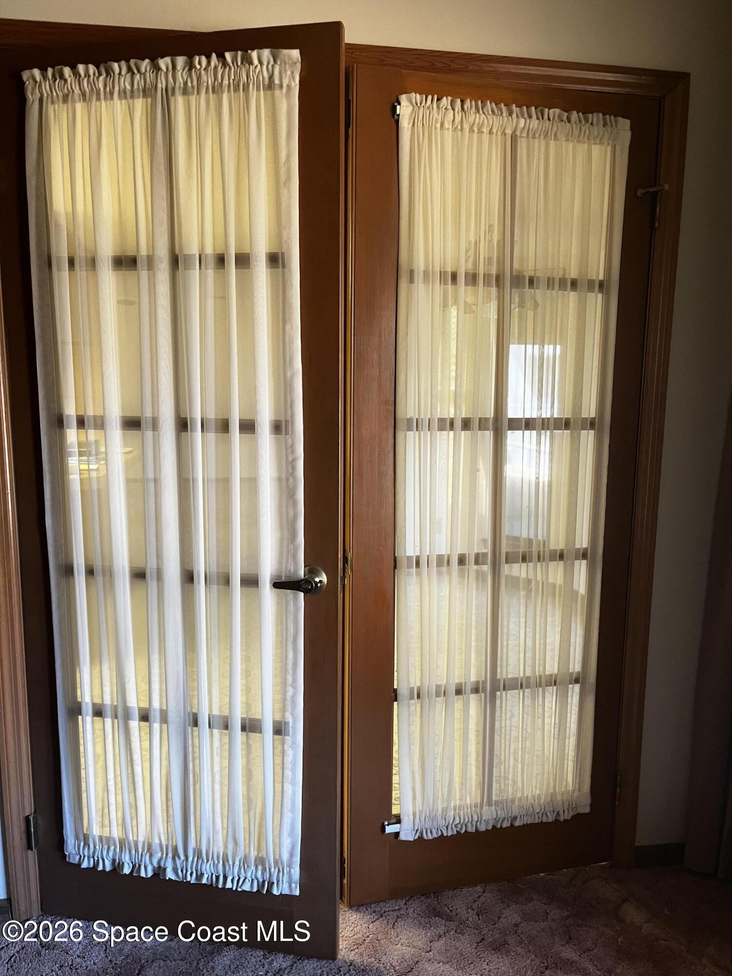 2328 Hamlet Drive Melbourne, FL 32934 - Photo 7 of 9 a view of a window with a front door