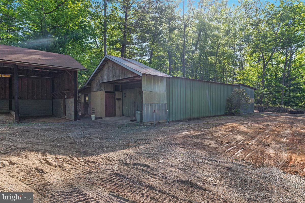 146 Lizzie Mills Road Castleton, VA 22716 - Photo 69 of 91 a view of a house with a yard and large tree