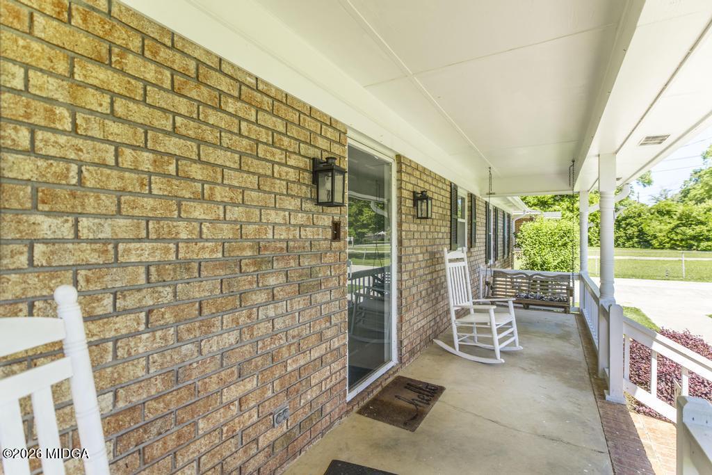 3710 Sandy Circle Macon, GA 31216 - Photo 6 of 44 a balcony with chairs and table