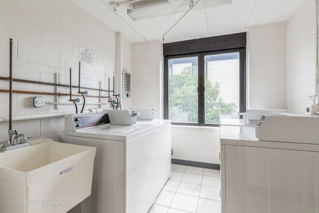 9701 North Dee Road, Unit 5M Niles, IL 60714 - Photo 14 of 21 a kitchen with a sink and a stove top oven