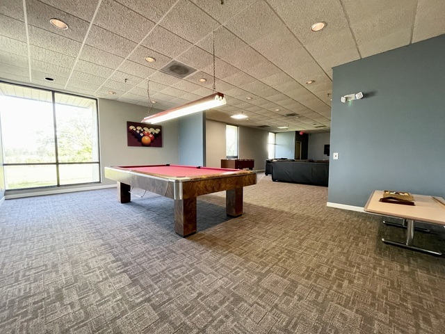 9701 North Dee Road, Unit 5M Niles, IL 60714 - Photo 18 of 21 a room with a bed and a window