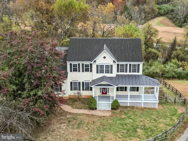 an aerial view of a house with outdoor space