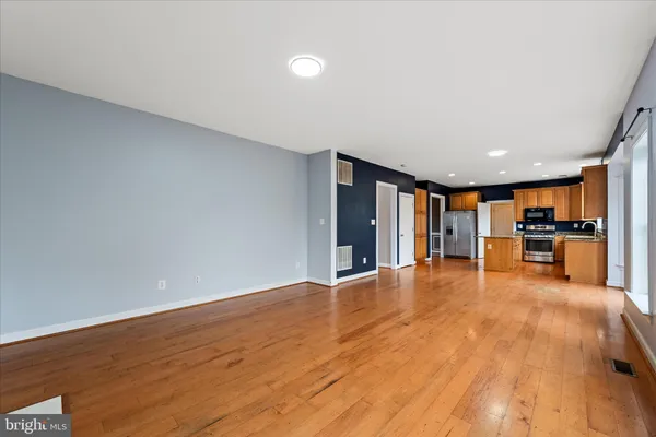 a white toilet sitting next to a bath tub and a shower
