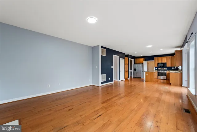 a white toilet sitting next to a bath tub and a shower