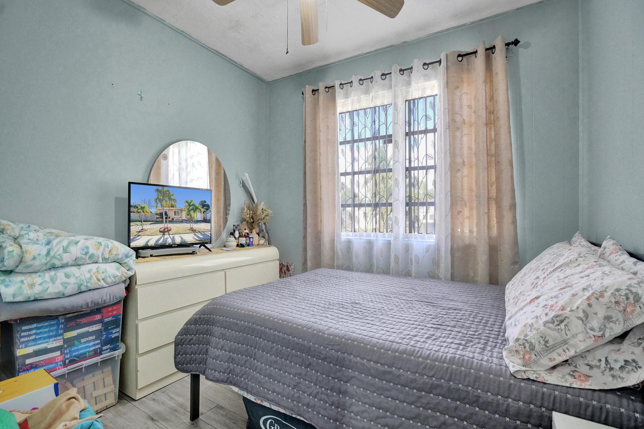 640 Northeast 24th Street Pompano Beach, FL 33064 - Photo 12 of 35 a bedroom with a bed and a window