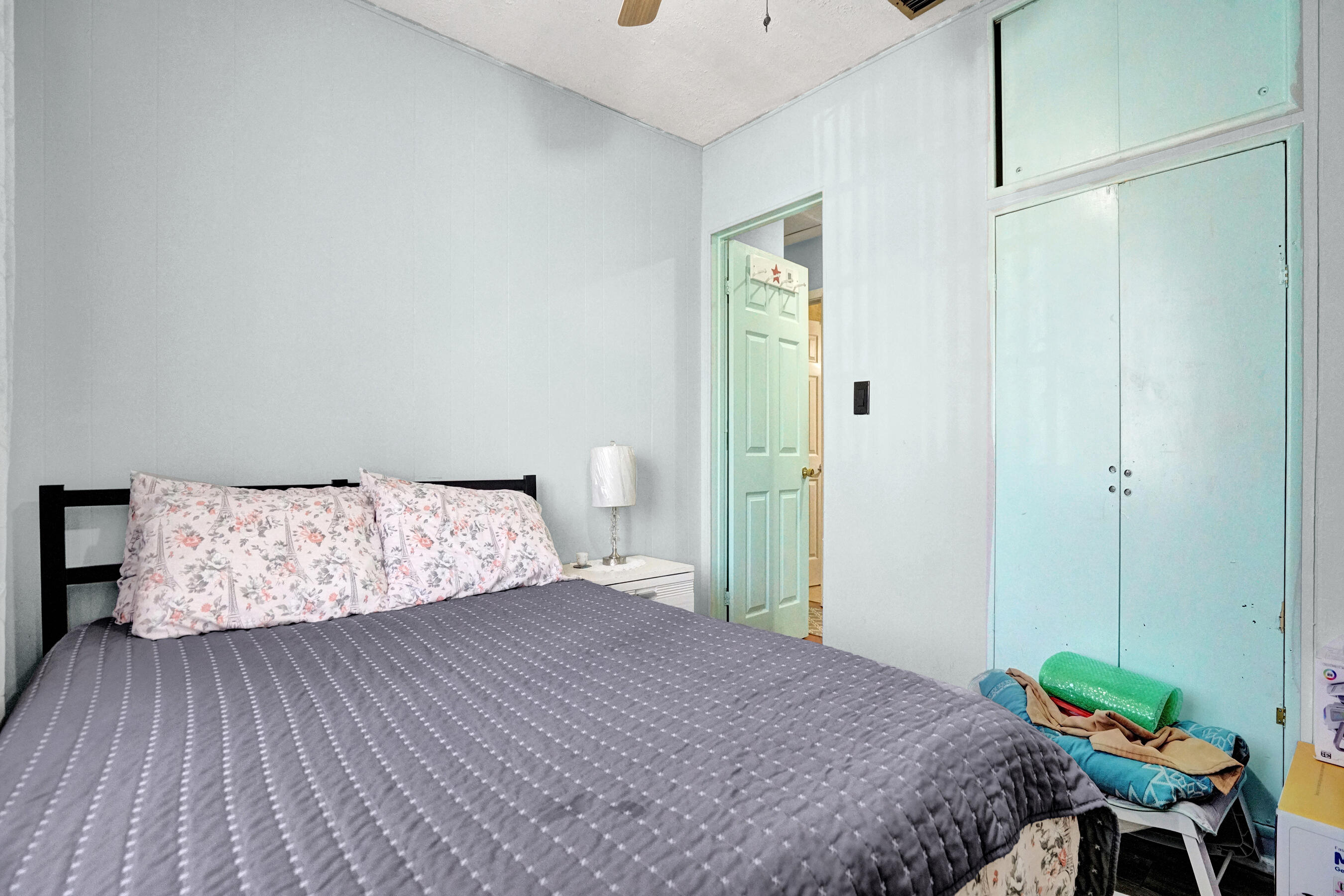 640 Northeast 24th Street Pompano Beach, FL 33064 - Photo 13 of 35 a bedroom with a bed and a dresser