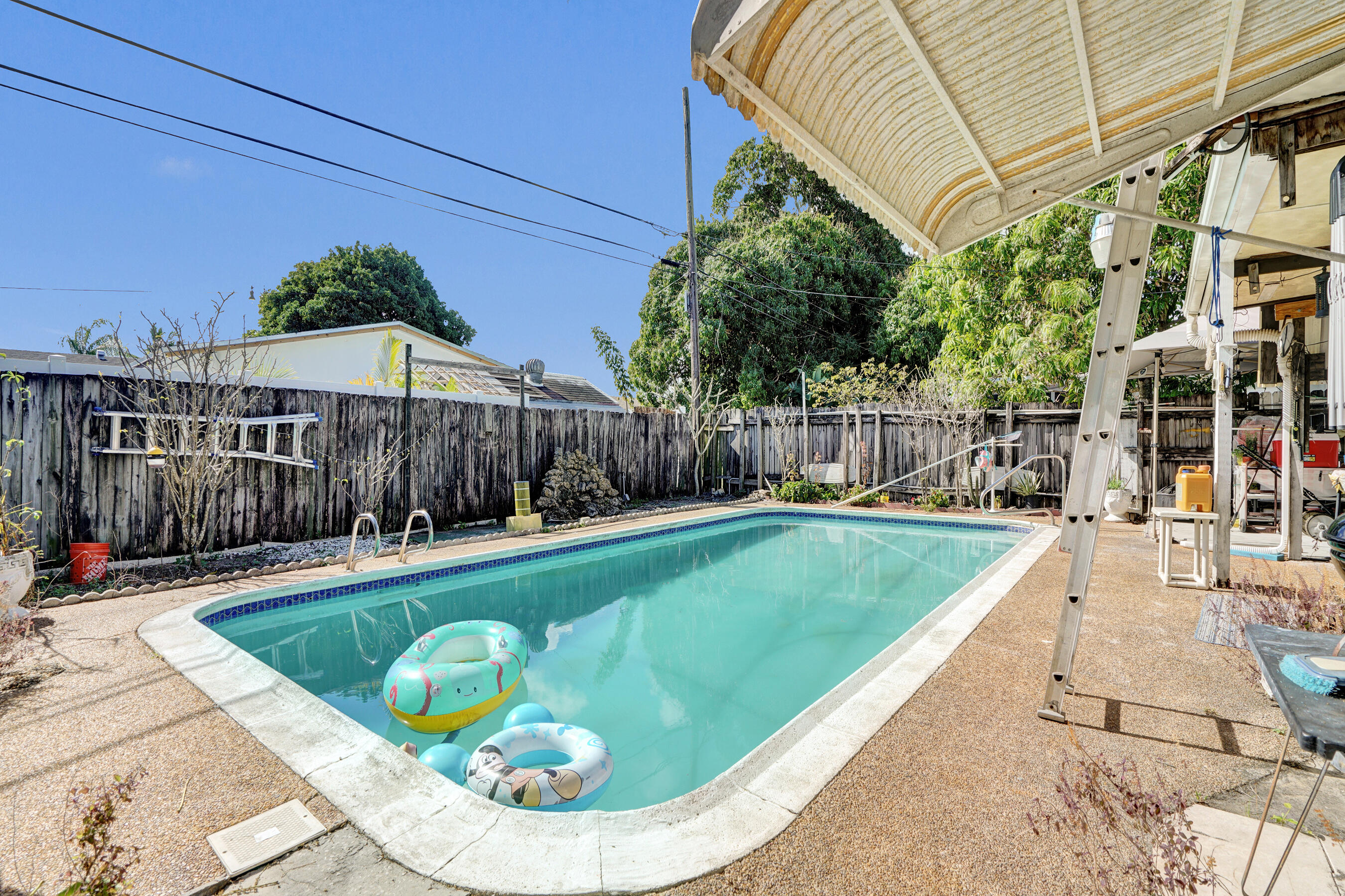 640 Northeast 24th Street Pompano Beach, FL 33064 - Photo 29 of 35 a view of a backyard with a swimming pool