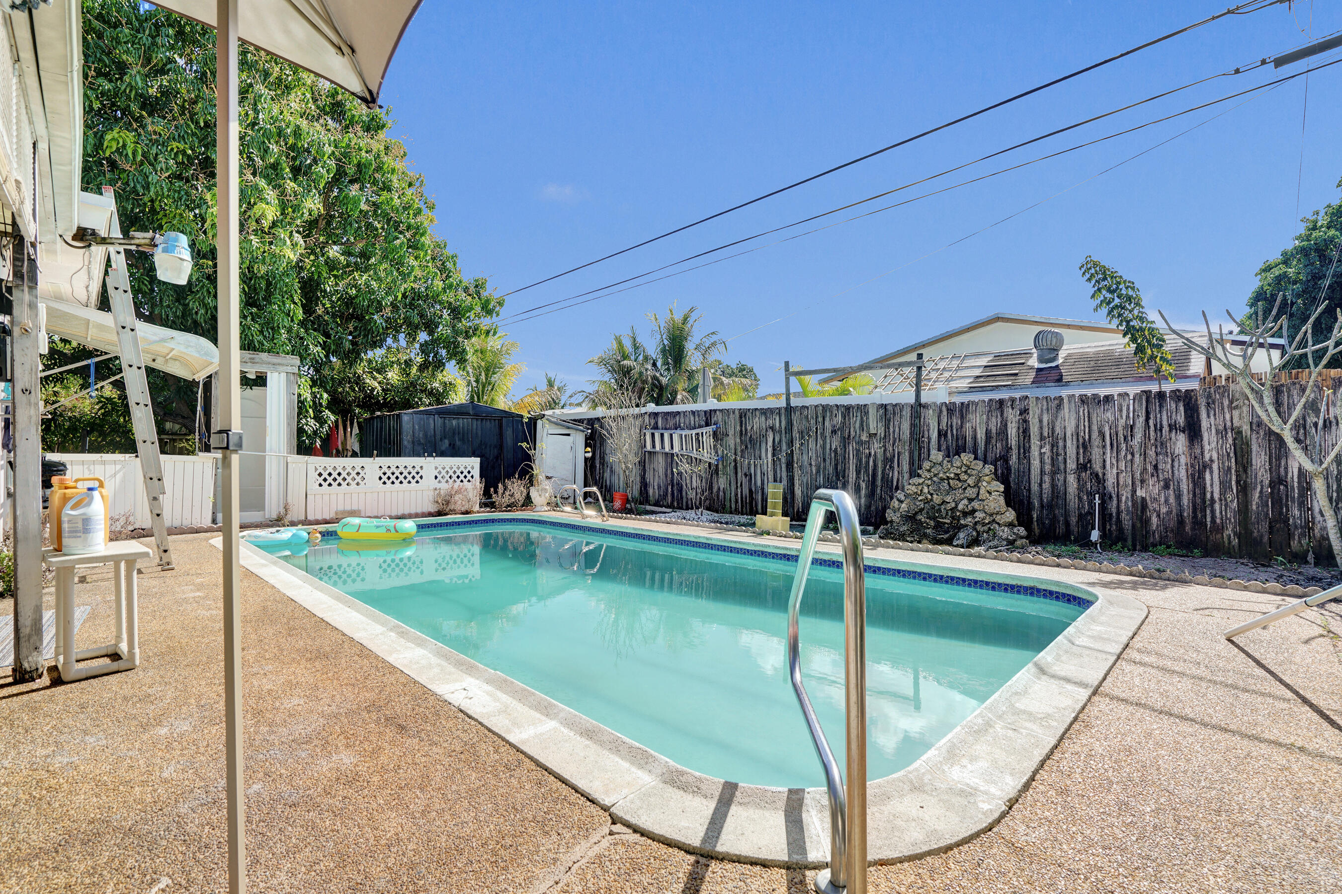 640 Northeast 24th Street Pompano Beach, FL 33064 - Photo 3 of 35 a view of a backyard with swimming pool