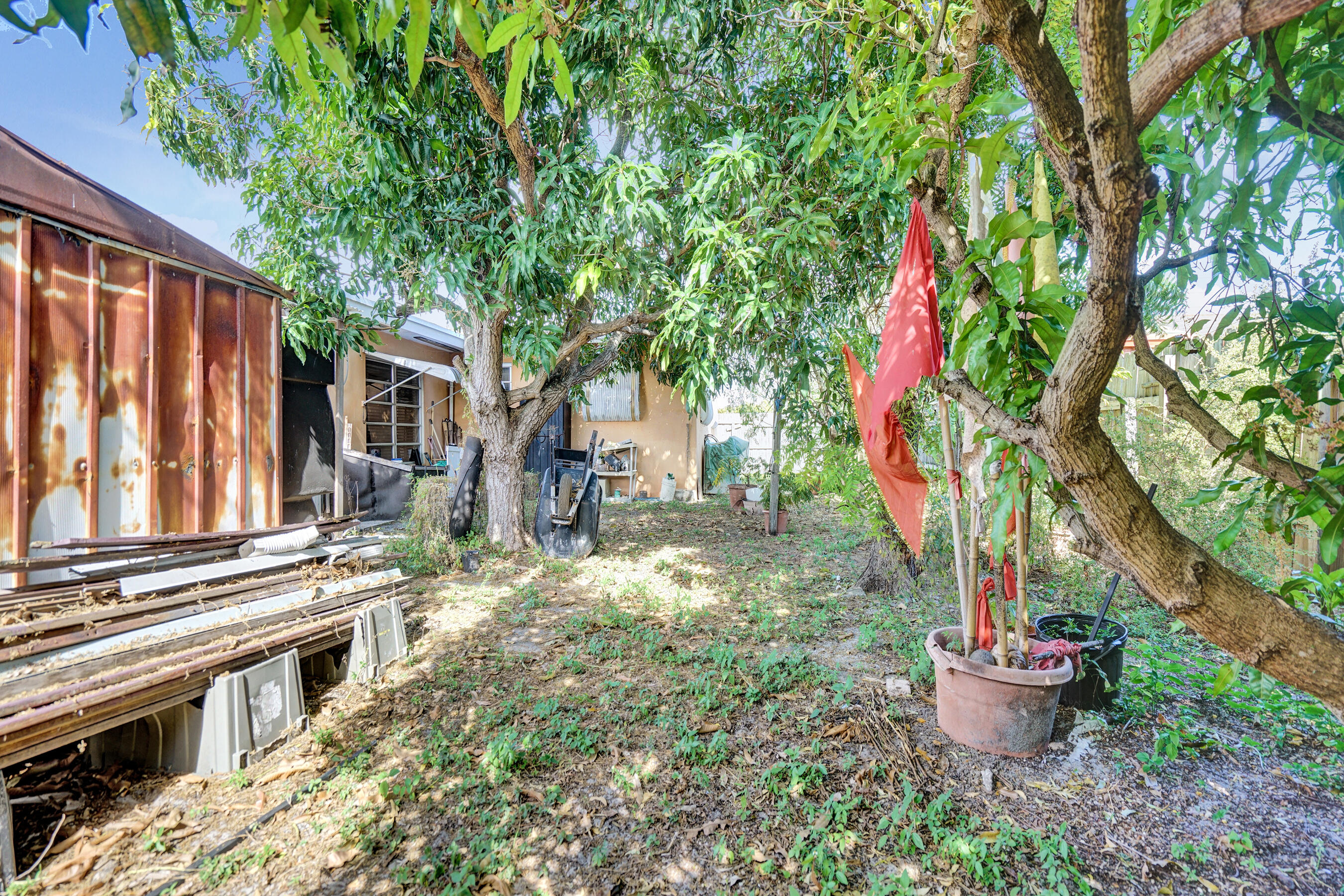 640 Northeast 24th Street Pompano Beach, FL 33064 - Photo 32 of 35 a front view of a house with a yard