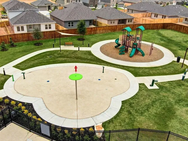 an aerial view of a house with deck and patio