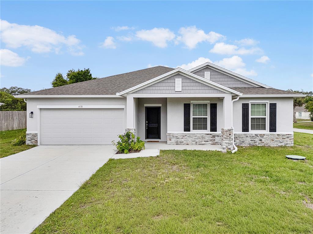 418 Fleming Street Sebastian, FL 32958 - Photo 3 of 38 front view of a house with a yard